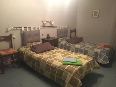 two beds in a room with green towels on them at Montagne d'Alaric in Moux