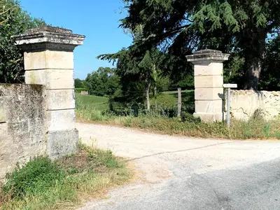 two stone pillars on the side of a road at La Lauze in Vielmur-sur-Agout