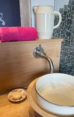 a kitchen sink with a faucet on a table at Le Jardin de LaCoste in Narbonne