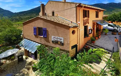 an aerial view of a building with a sign on it at Logis auberge restaurant Du Vigneron in Cucugnan