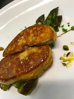 two pieces of food on a white plate at Logis Hotels - Hôtel et Restaurant de la Montagne Noire in Dourgne