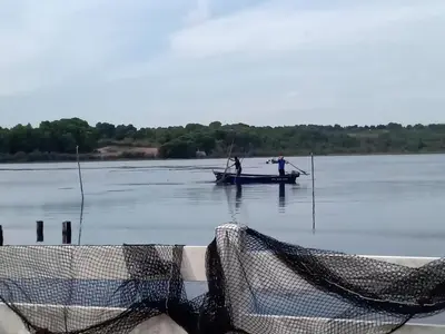 two people on a boat in the water at Maison de pecheur in Sigean