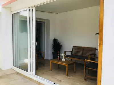 a living room with a couch and a table at Gite Blanco y Madera in Narbonne