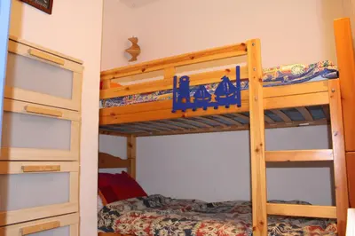 a bunk bed room with two bunk beds at Gites de France Bleu à la mer in Port-la-Nouvelle