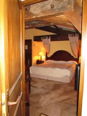 an open door to a bedroom with a bunk bed at Château de Floure - SPA et piscine extérieure chauffée in Carcassonne