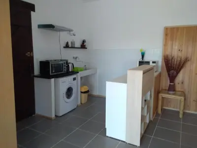 a kitchen with a washing machine and a microwave at loft At Besset in Besset