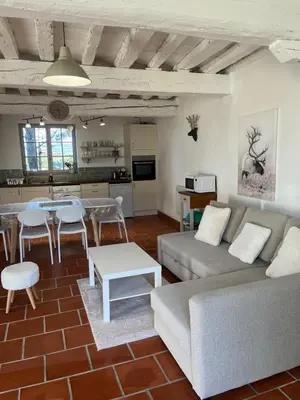 a living room with a couch and a table at Domaine Saladry in Villepinte