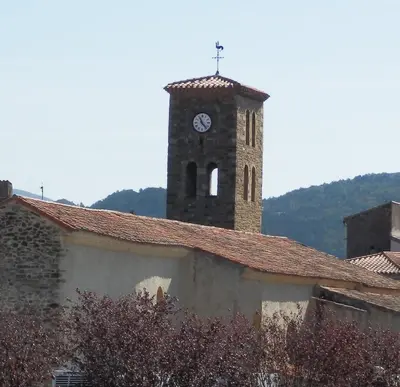 a clock tower on top of a building at The Railway Cottage at Montazels in Espéraza