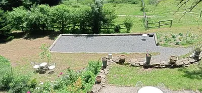 an aerial view of a garden with a swimming pool at Gîte rural, relais équestre Le Tulipier in Pradelles-Cabardès