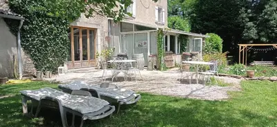 a group of chairs and tables in a yard at Gîte rural, relais équestre Le Tulipier in Pradelles-Cabardès