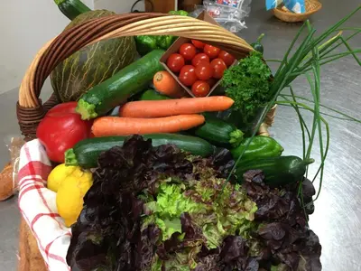 a basket full of vegetables on a table at Hotel Axat in Axat