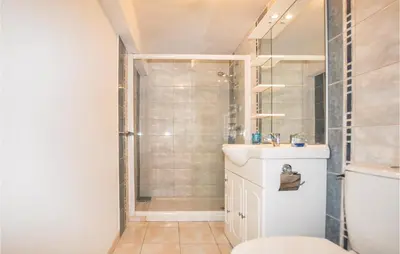a bathroom with a shower and a sink at Cozy Apartment In Vinassan With Wifi in Vinassan