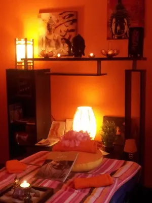 a bedroom with a bed with a lamp on it at La Lucques Masabelle in Mirepeisset