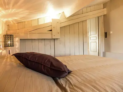 a pillow sitting on a bed in a bedroom at Holiday Home in Loupia with Private Pool in Loupia