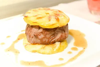 a muffin with an egg on top on a plate at Logis Hôtel Restaurant des Corbières in Lagrasse