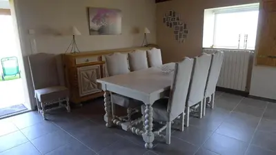 a dining room with a table and chairs at gite a la campagne in Noailhac