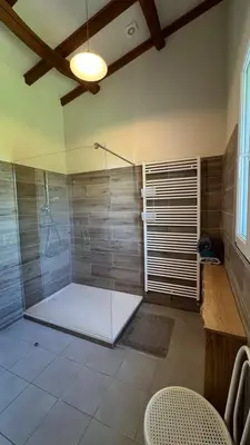 a bathroom with a shower with a glass door at gite a la campagne in Noailhac