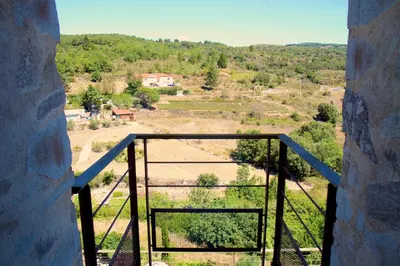 a view from a window looking out at a field at Domaine Riberach - Restaurant étoilé - Spa - Piscine naturelle - Vignoble bio in Bélesta