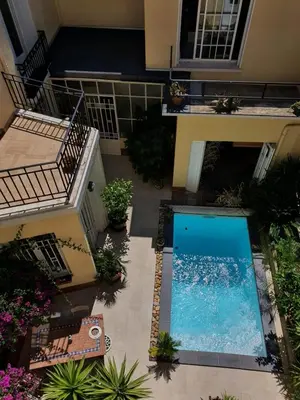 an overhead view of a swimming pool in a house at B&B Le Patio En Ville - Chambres d'hôtes in Narbonne