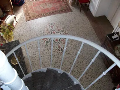 an overhead view of a spiral staircase with an umbrella at Le Domaine Du Chapitre in Carcassonne