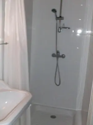 a bathroom with a shower and a sink at Le Domaine Du Chapitre in Carcassonne