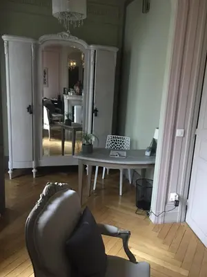a living room with a couch and a table at GUESTHOUSE La VILLAE in Mazamet