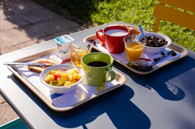 a tray of food and drinks on a table at ibis budget Carcassonne Aéroport - A61 in Carcassonne