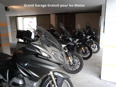 a row of motorcycles parked in a garage at Hotel Astoria in Carcassonne