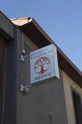 a sign on the side of a building at Adonis Carcassonne in Carcassonne