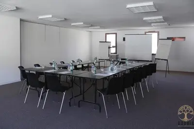 a large conference room with a long table and chairs at Adonis Carcassonne in Carcassonne