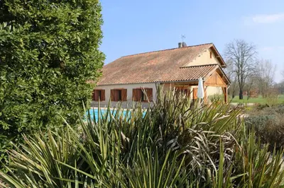 a house with a swimming pool in front of it at Maison d'hôtes Saint Alary in Lavaur