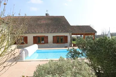 a house with a swimming pool in front of a house at Maison d'hôtes Saint Alary in Lavaur