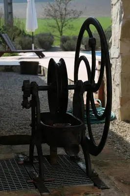a statue of an old at Maison d'hôtes Saint Alary in Lavaur