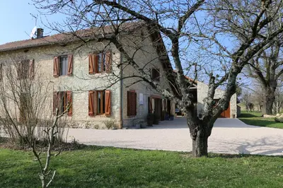 an old house with a tree in front of it at Maison d'hôtes Saint Alary in Lavaur