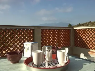a tray with cups and utensils on a table at Chez Pierre in Bélesta