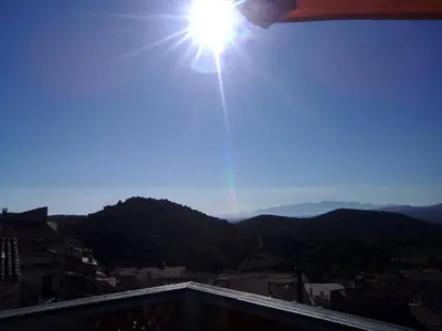 a view of the sun from a balcony at Chez Pierre in Bélesta