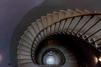 a spiral staircase in a building at Chateau de Blomac in Blomac