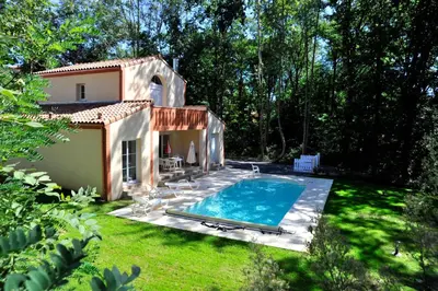 a swimming pool in the yard of a house at Lagrange Vacances - Royal Green in Pont-de-Larn