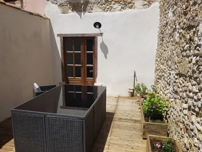 a room with a wooden walkway and a door at Le Leon d'or in Mirepoix