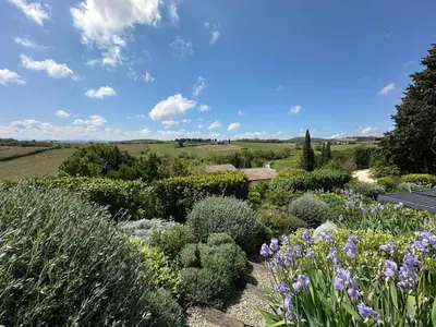 a garden with various plants and flowers on a field at Le Petit Cinq in Brézilhac
