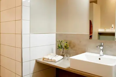 a bathroom with a sink and a mirror at LOFT - Powered by LIEU - in Villedaigne