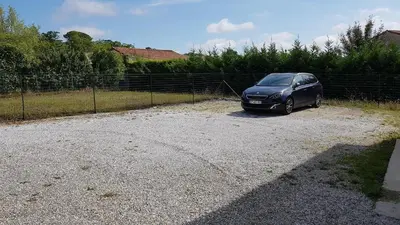 a black car is parked in a driveway at Gite Pourquoi Pas in Montégut-Lauragais