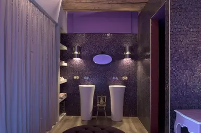 a bathroom with purple walls and a purple ceiling at Village Castigno - Wine Hotel & Resort in Assignan