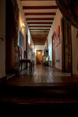 a hallway of a house with a wooden floor at Relais de l'Alaric in Moux
