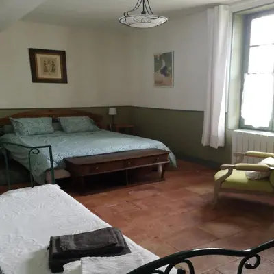 a bedroom with two beds and a window at La Bonne Planque - Maison éclusière de la Domergue Canal du Midi in Mas-Saintes-Puelles