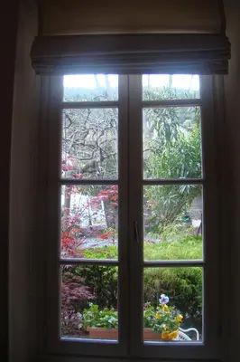 a window with a view of a garden outside at l'Oulibo in Villeneuve-les-Corbières