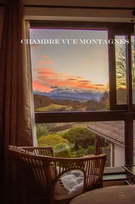 a window with a view of a mountain view at Belloréade Maison d'hôtes in Belloc