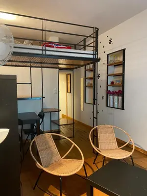 two chairs and a table in a room with a bunk bed at Big in Narbonne