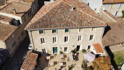 an overhead view of a large stone building with red roofs at La Marelle chambre d hôtes à 500m du Canal du Midi in La Redorte