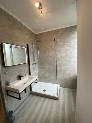 a bathroom with a sink and a shower at La Marelle chambre d hôtes à 500m du Canal du Midi in La Redorte